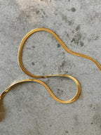 Cobra guld-set: matchande halsband & armband