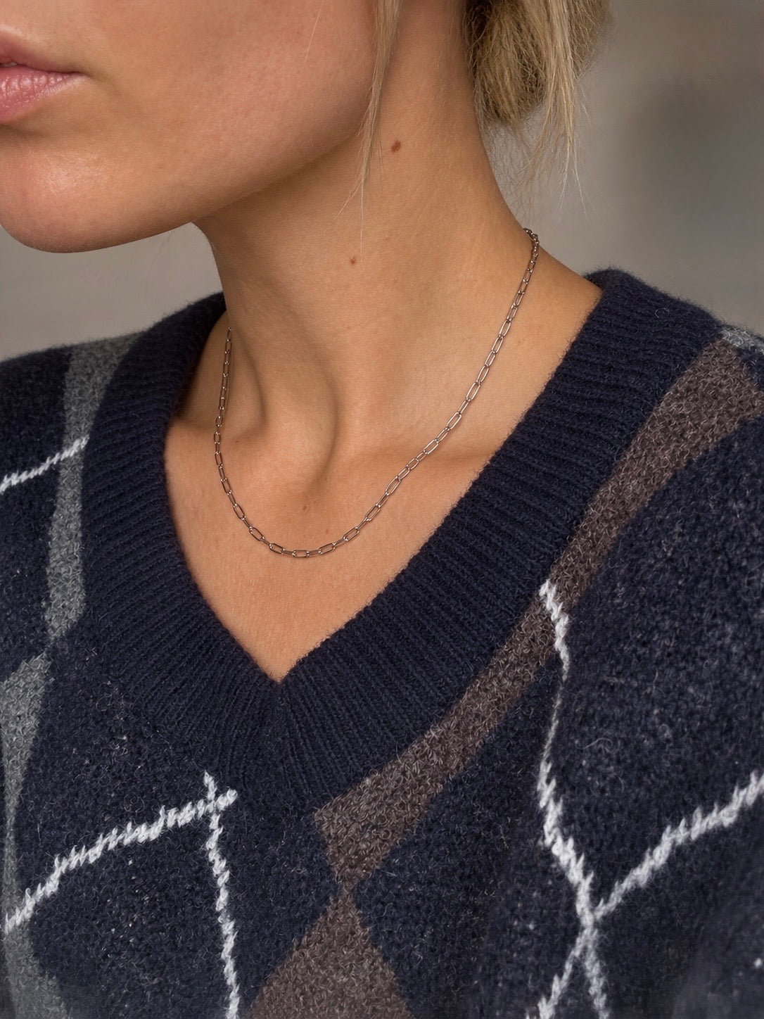 Silvia Berlin necklace in stainless steel from Alora Avenue, worn by model.